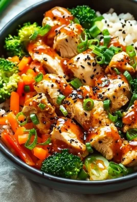 Delicious Bang Bang Chicken Bowl with spicy chicken and fresh vegetables