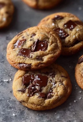 Freshly baked chewy chocolate chip cookies on a cooling rack