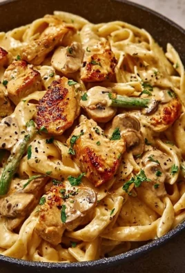 Creamy Cajun Chicken Pasta served with vibrant vegetables and spices
