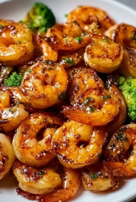 High-protein honey garlic shrimp dish garnished with herbs