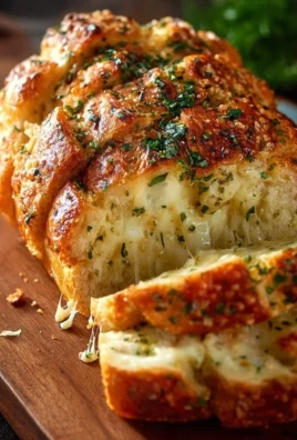 Freshly baked Italian Herb Cheese Bread with aromatic herbs and melted cheese