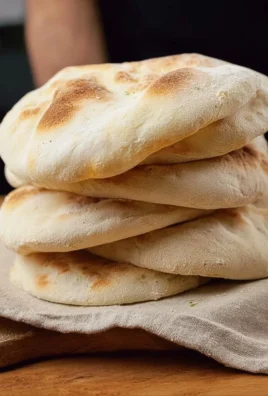 Homemade pita bread stuffed with fresh vegetables and hummus