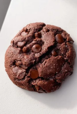 Single serve double chocolate chip cookie on a plate, showcasing rich chocolate chips