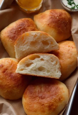Soft fried buns golden brown and fluffy, perfect for snacking or serving as appetizers.