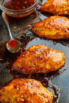 Delicious baked firecracker chicken served with vibrant vegetables