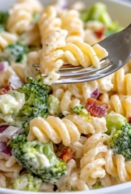 Delicious broccoli pasta salad with colorful vegetables and dressing