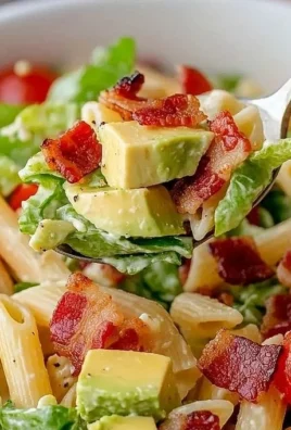Gluten Free Dairy Free BLT Pasta Salad in a bowl garnished with fresh herbs.