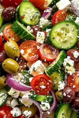 Fresh Greek salad with tomatoes, cucumbers, feta cheese, and olives