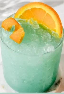 Blue Hawaiian Mocktail drink garnished with fruit, served in a glass.