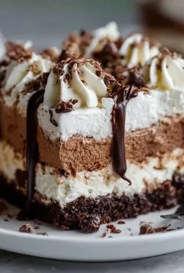 Delicious Brownie Refrigerator Cake layered with cream and chocolate