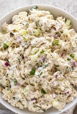 Delicious chicken salad served in a bowl with fresh vegetables