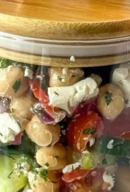 A vibrant chickpea cucumber salad with fresh herbs and vegetables