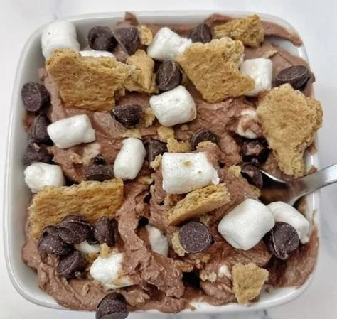 Delicious Chocolate Protein S'mores Bowl topped with marshmallows and chocolate chips.
