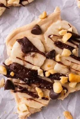 Chunky Monkey Frozen Yogurt Bark topped with banana slices and chocolate chips