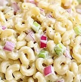 Classic Macaroni Salad in a serving bowl, featuring creamy dressing and vegetables.