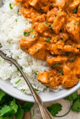 Coconut Chicken Rice Bowl topped with fresh ingredients and garnishes