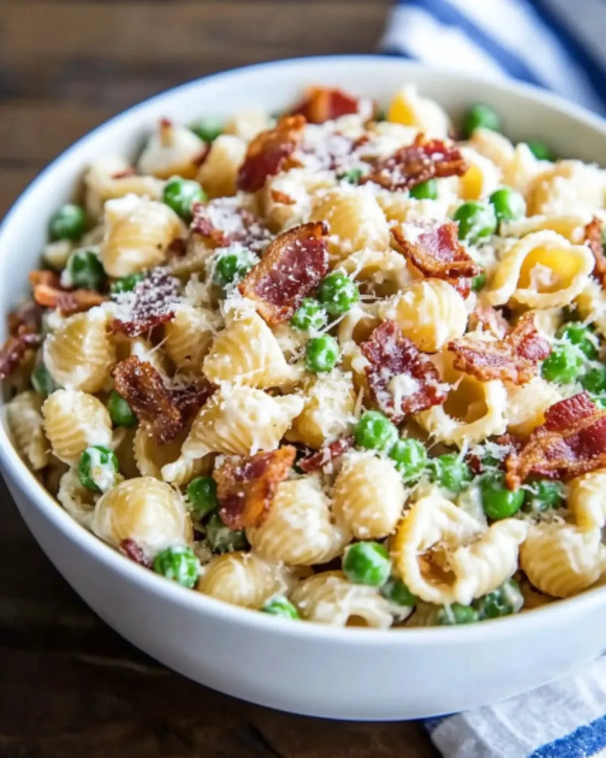 Creamy pasta salad with vegetables and dressing in a bowl