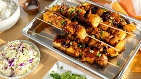 Delicious Hawaiian Chicken Kabobs on skewers with colorful peppers and pineapple.