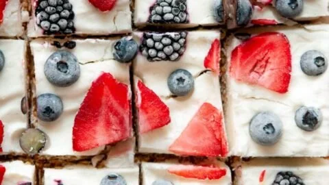 Frozen yogurt granola bars stacked on a plate, showcasing their creamy and crunchy texture.
