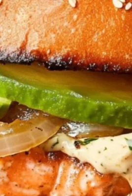 Gordon Ramsay's delicious salmon burger served with toppings and sides.