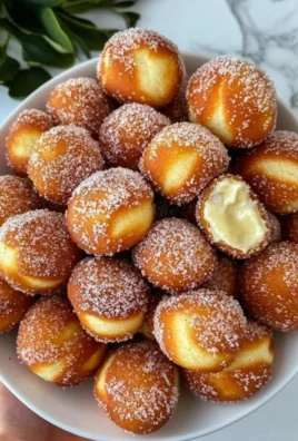 Delicious Hawaiian Malasadas dusted with sugary goodness