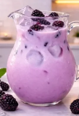 Homemade blackberry coconut drink with fresh blackberries and coconut milk.