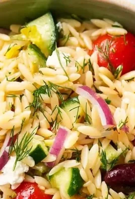 Juicy Mediterranean Orzo Pasta Salad with vibrant vegetables and herbs