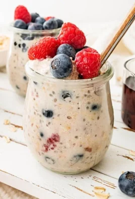 Bowl of low calorie overnight oats topped with fruits and nuts
