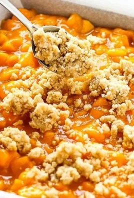 Delicious Mango Crumb Bars with tropical mango filling and buttery crumb topping