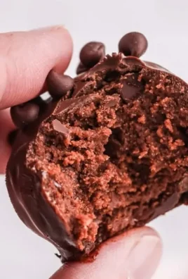 Delicious no-bake brownie bites on a plate, perfect for a sweet treat.