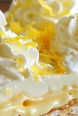 Delicious no-bake lemon eclair cake topped with lemon icing and fresh fruits
