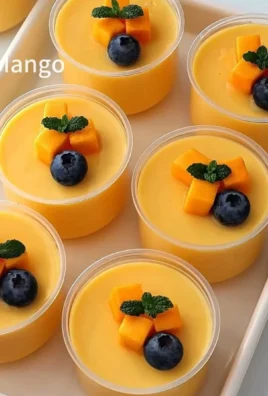 Delicious no-bake mango panna cotta dessert served in glass cups