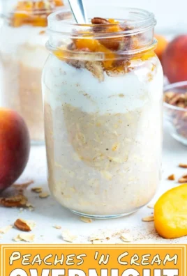 Delicious Peach Cobbler Overnight Oats topped with fresh peaches and cinnamon.