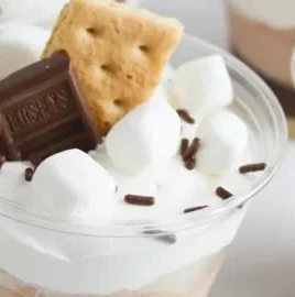 Delicious S'mores pudding parfaits layered with chocolate, marshmallow, and graham crackers.