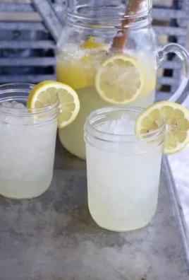Pitcher of refreshing summertime lemonade served for a large gathering.