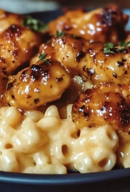 Sweet and Spicy Honey Pepper Chicken served with creamy macaroni cheese.