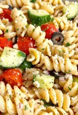 Delicious pasta salad with colorful vegetables and Italian dressing