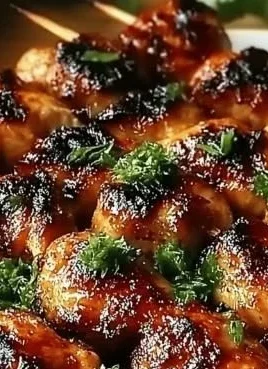 Grilled Thai coconut chicken skewers served on a tropical-themed plate.