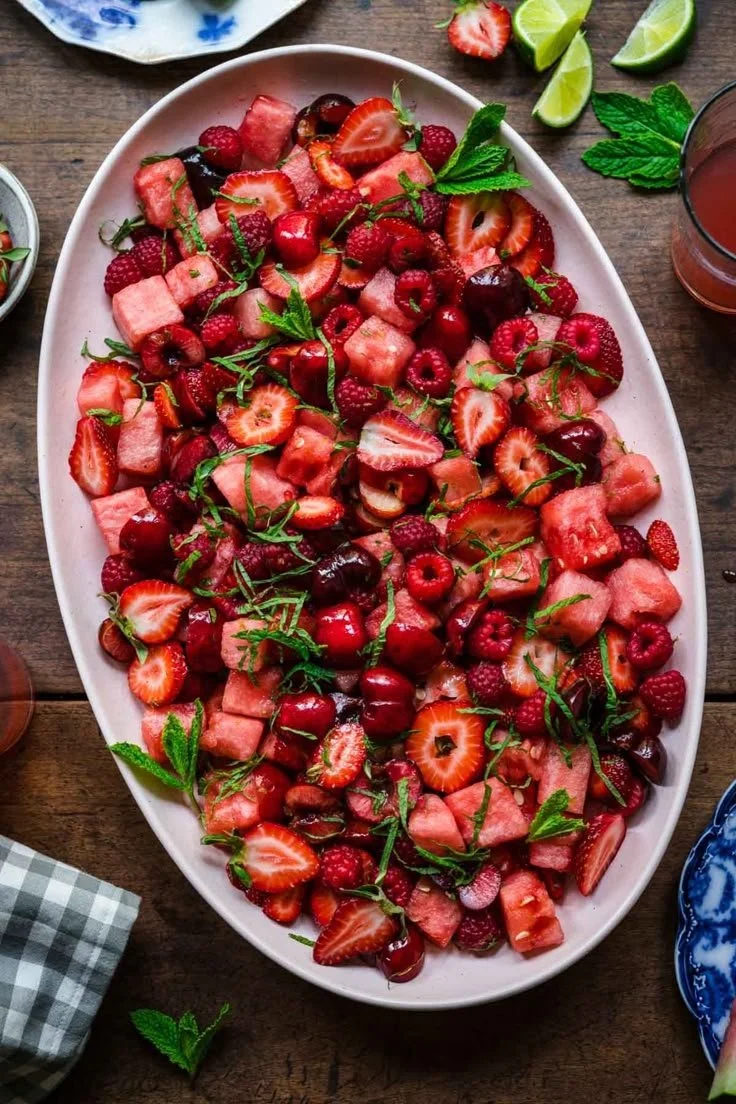 Colorful watermelon fruit salad with mixed fruits in a bowl.