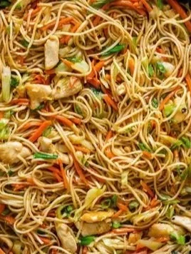 Delicious plate of best ever chicken chow mein with colorful vegetables and chicken