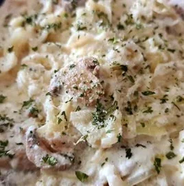 Delicious Cabbage Alfredo served with garnishes on a plate