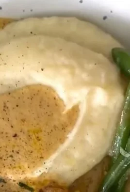 Chicken Schnitzel with creamy sauce served on a plate