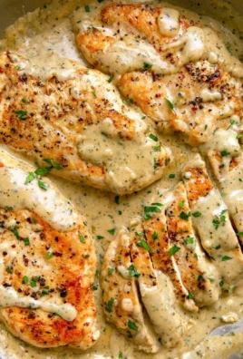 Creamy Ranch Chicken dish garnished with herbs on a plate