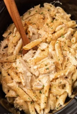 Crock Pot Cajun Chicken Pasta served in a bowl with fresh parsley