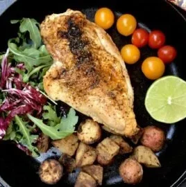 Delicious serving of Devil's Chicken with vibrant spices and herbs