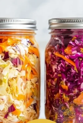 A jar of homemade sauerkraut with fresh cabbage and spices.