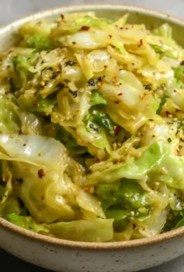 Plate of sautéed cabbage with garlic and spices, ready to serve.