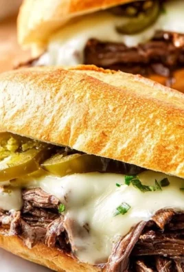 Slow Cooker Mississippi Pot Roast Sandwich served on a plate with coleslaw