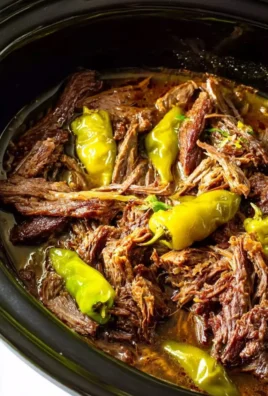 Delicious Slow Cooker Mississippi Pot Roast Sandwiches served on a plate