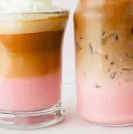 Delicious Strawberry Latte topped with foam and fresh strawberries